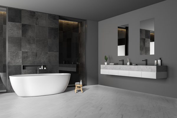 modernbathroomcornerwithblacktilewallsconcretefloorwhite