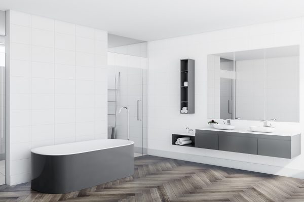 cornerofstylishbathroomwithwhitetilewallscomfortablegray